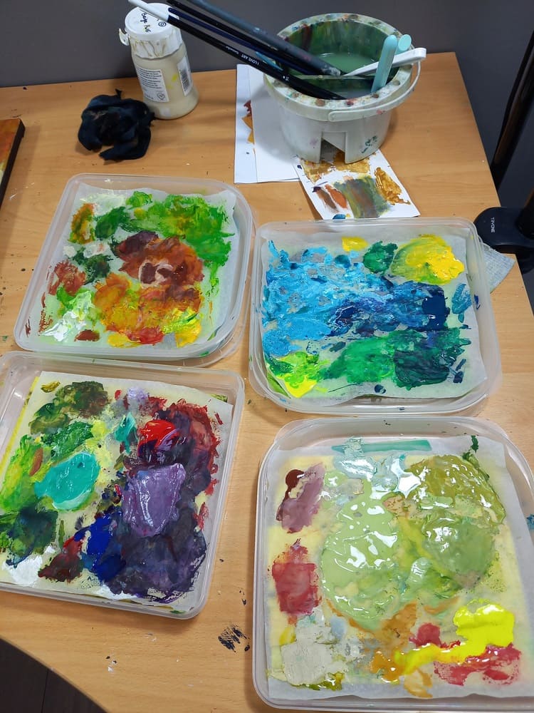 Color palettes and brushes in Aurélie Rocheta's studio, illustrating her artistic approach.
